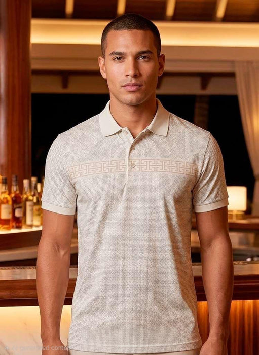 Man wearing a light-colored polo shirt in an indoor setting with warm lighting