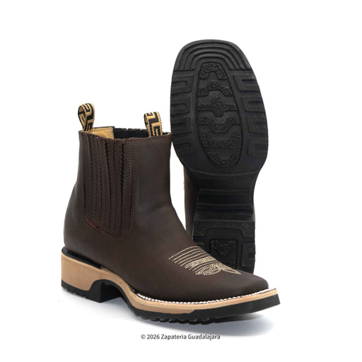 Brown leather boot with beige trim on a white background