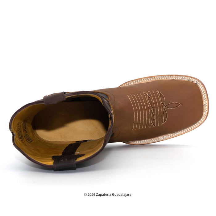A single brown leather ankle boot shown from a side profile view on a white background, featuring decorative stitching on the vamp and a tan interior.