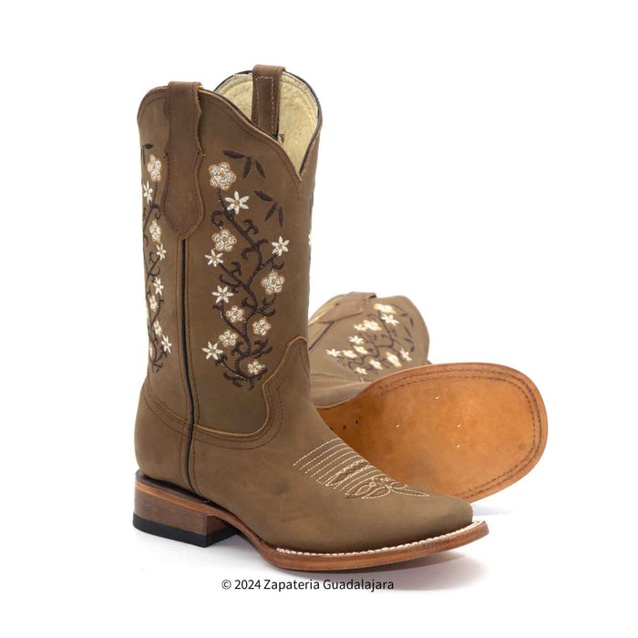 Brown cowboy boot with floral embroidery on a white background