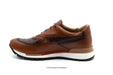 Brown leather shoe with white sole on a white background