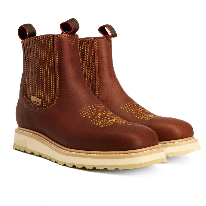 Pair of brown leather boots with beige soles on a white background