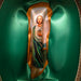 A religious icon plaque depicting Jesus Christ and the Virgin Mary, mounted on a gold-colored ribbon and displayed inside a green satin-lined presentation box.