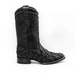 A black matte finish boot with a unique geometric patterned skin texture, likely made from Pirarucu leather, with a square toe and a pull tab on the back.
