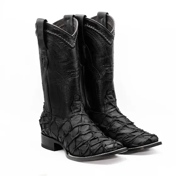 Pair of black cowboy boots with textured design on a white background