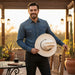Zapateria Guadalajara cream cowboy hat with black band and colorful feather accent. Limited edition.