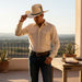 Zapateria Guadalajara cream felt cowboy hat with black band, gold buckle, and colorful feather accent. 4.5" crown, 3.5" brim.