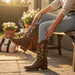 Zapateria Guadalajara women's tan leather cowboy boots with white floral embroidery on the shaft and a wide square toe.